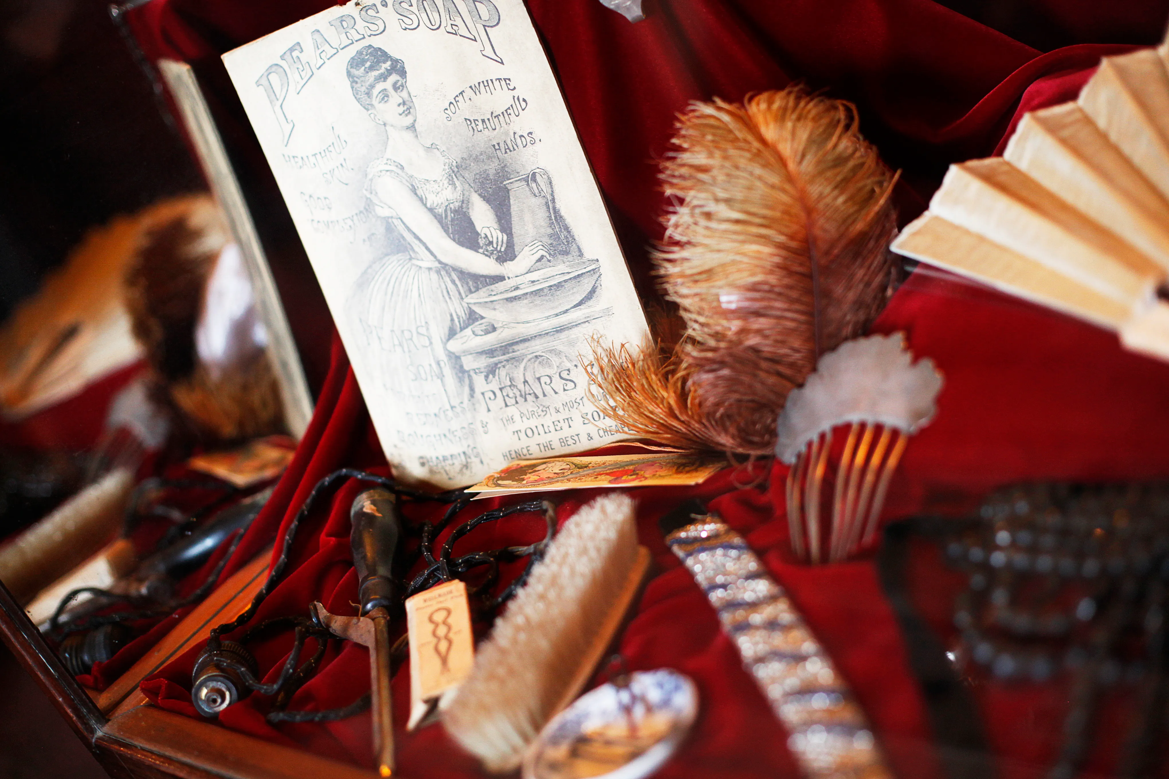 Original artifacts and dolls in the brothel museum display case
